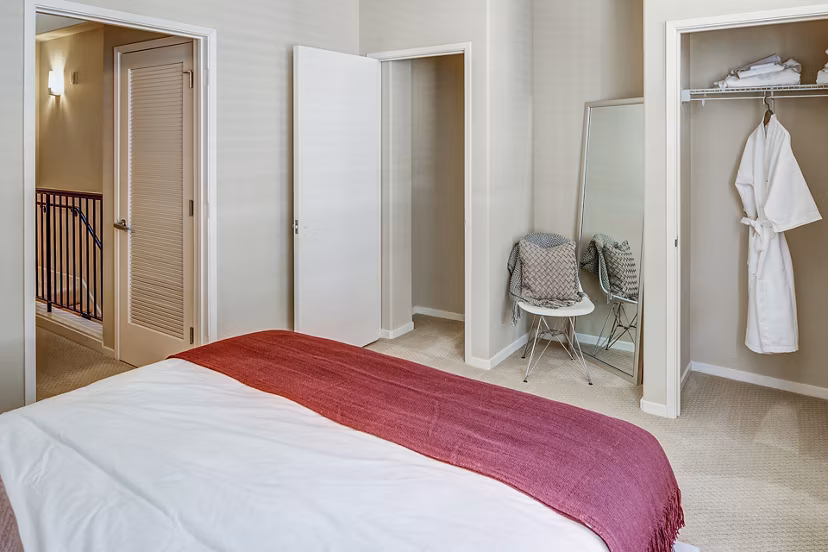 Elegant bedroom with plush bedding and contemporary design at Santana Row Apartments, luxury living in a vibrant community