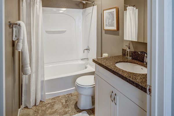Bathroom featuring modern fixtures and elegant design at Santana Row Apartments