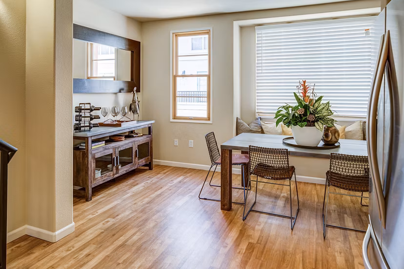 Dining area featuring modern decor and elegant lighting in Santana Row Apartments
