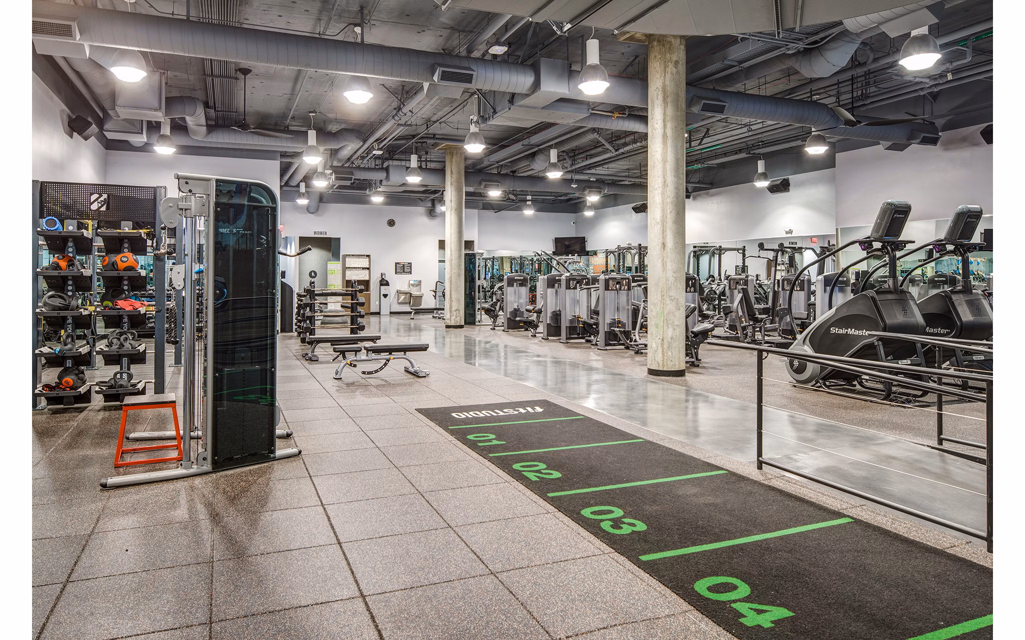 Fully-equipped fitness center featuring modern exercise machines at Santana Row Apartments