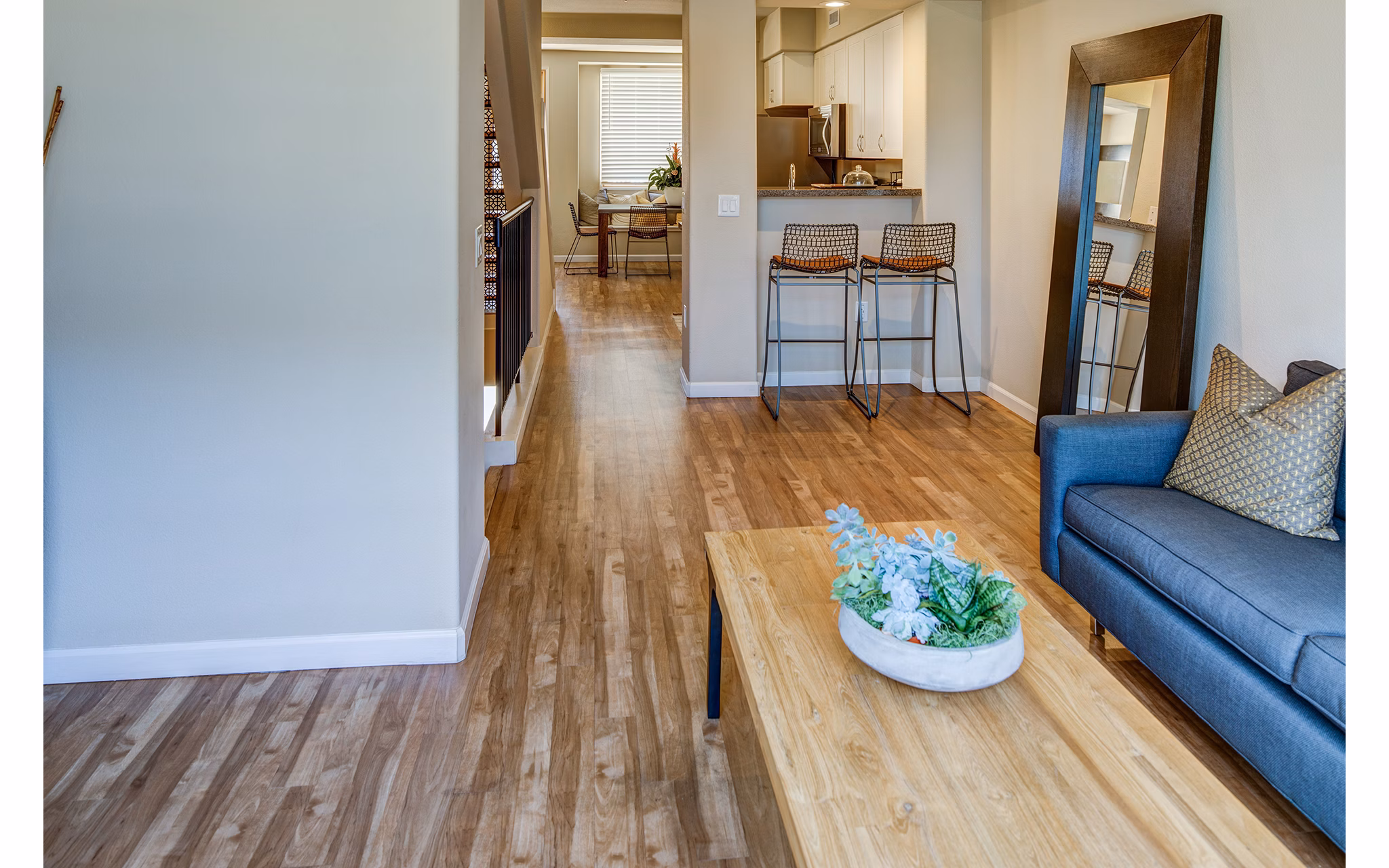 Modern living room with stylish decor at Santana Row Apartments, featuring luxury Greystar interiors