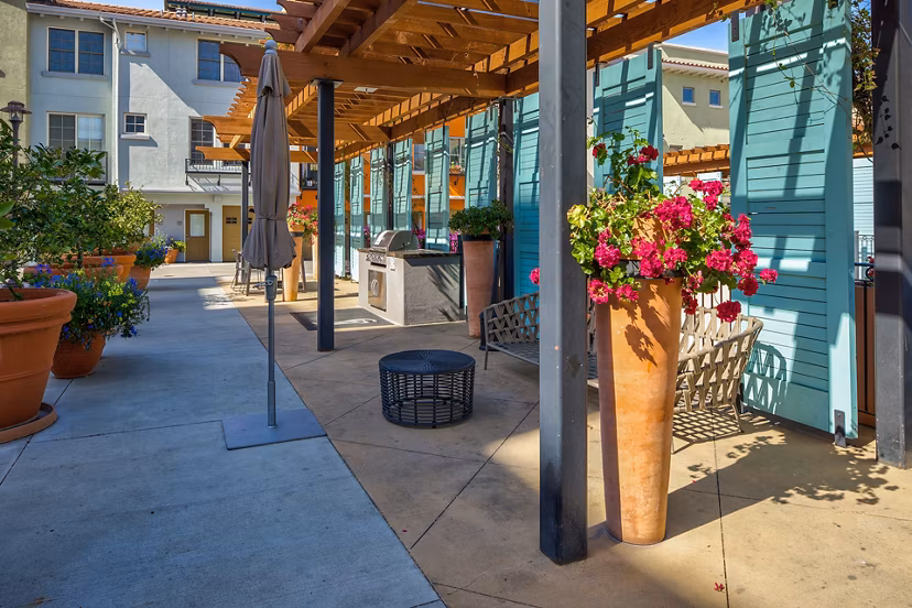 Santana Row Apartments: Scenic courtyard with lush greenery and seating areas in a luxury community in San Jose
