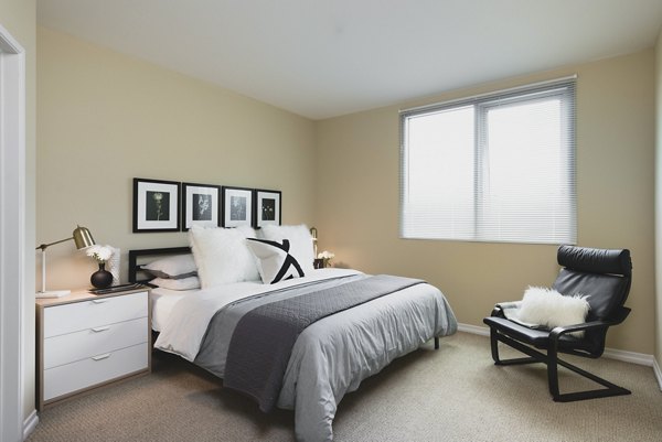 Cozy bedroom featuring modern design at Wilshire Vermont Station Apartments