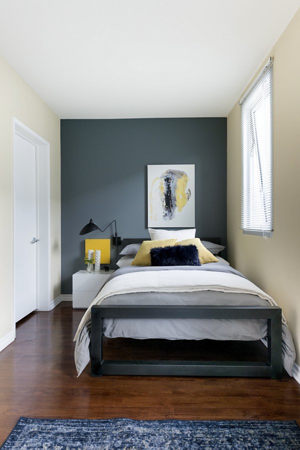 Wilshire Vermont Station Apartments: Cozy bedroom with modern decor and natural light