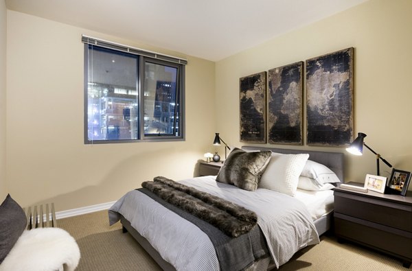 Modern bedroom with sleek furnishings at Wilshire Vermont Station Apartments