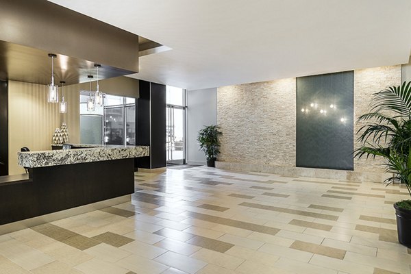 Clubhouse with modern design and open seating areas at Wilshire Vermont Station Apartments in a luxury Greystar community