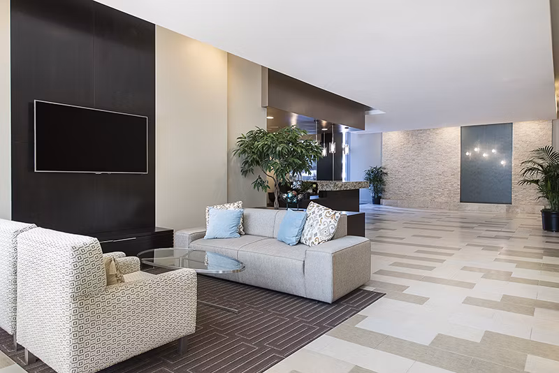 Clubhouse with stylish seating and modern decor at Wilshire Vermont Station Apartments