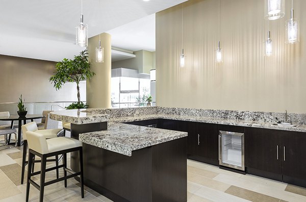 Clubhouse with modern furnishings and vibrant decor at Wilshire Vermont Station Apartments