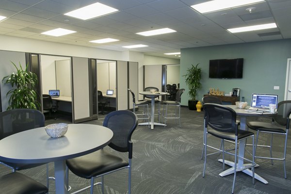 Wilshire Vermont Station Apartments: Elegant clubhouse with modern design and comfortable seating in Los Angeles