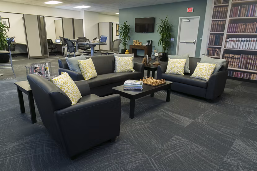 Clubhouse with modern seating and open spaces at Wilshire Vermont Station Apartments in Los Angeles