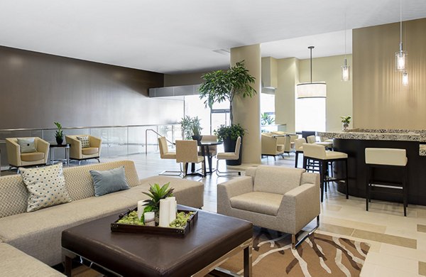 Clubhouse with modern design and communal seating at Wilshire Vermont Station Apartments