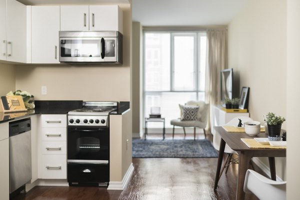 Wilshire Vermont Station: Modern kitchen with sleek cabinetry and stainless steel appliances in luxury Los Angeles apartments