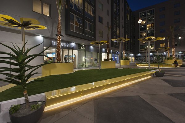 Welcoming courtyard with lush greenery at Wilshire Vermont Station Apartments