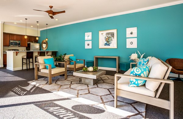 Clubhouse featuring modern design and ample seating at Apex Apartments