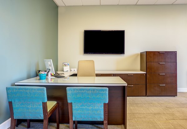 Luxurious clubhouse featuring modern seating and entertainment at Apex Apartments in city center
