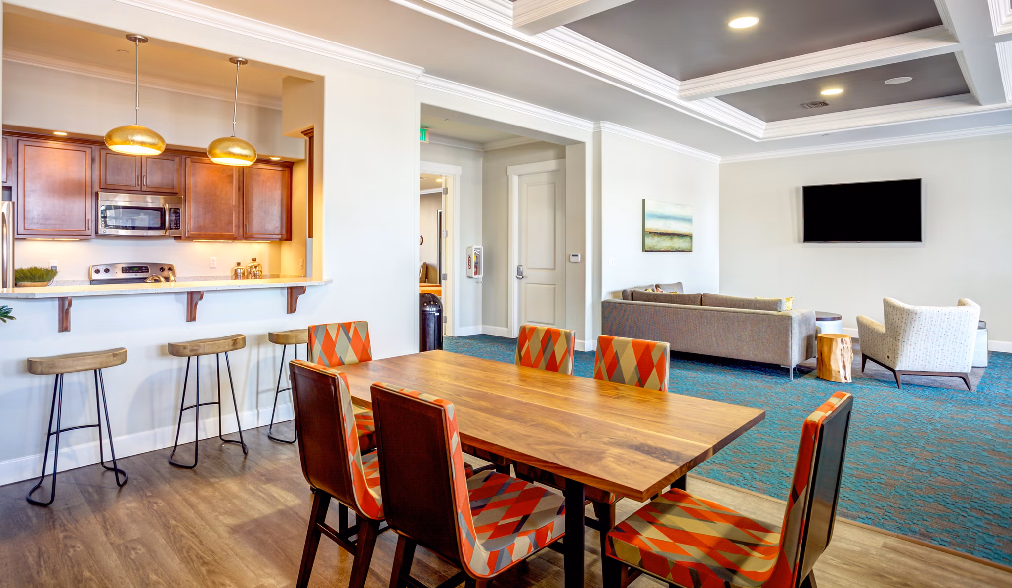 Elegant clubhouse with modern seating and large windows at Apex Apartments, ideal for luxury living and community gatherings