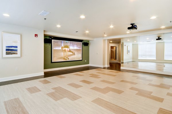 Yoga and spin studio offering group classes at Apex Apartments with modern equipment and serene design