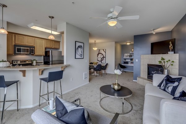 Modern living room with sleek furniture in Apex Apartments, showcasing luxury design and comfort