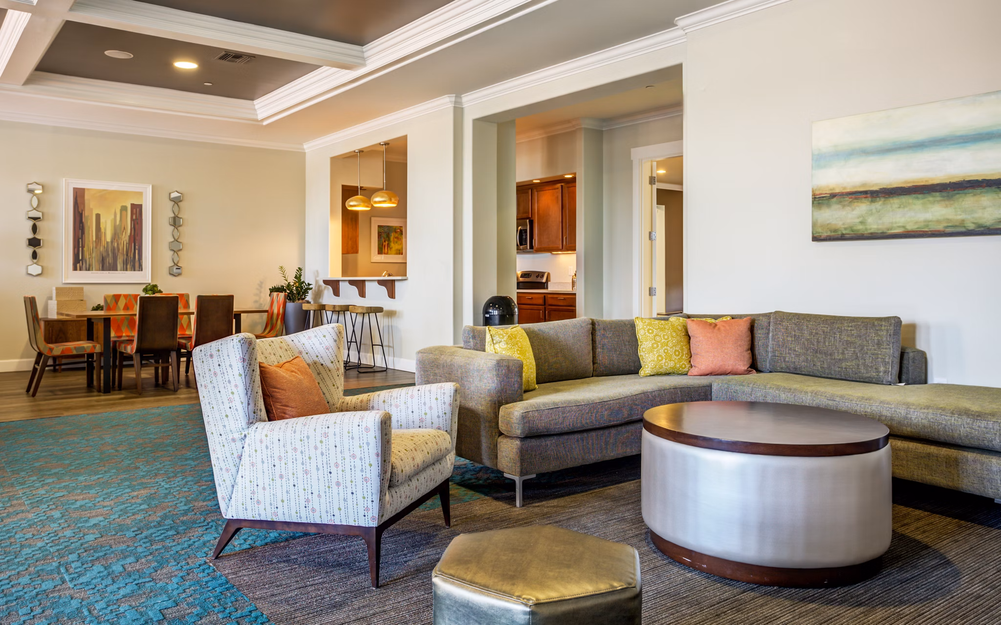 Living room with modern decor and natural light at Apex Apartments