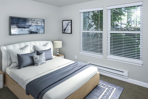 Luxurious bedroom with elegant furnishings at Parkridge Apartments, offering a serene and comfortable living space in this upscale community