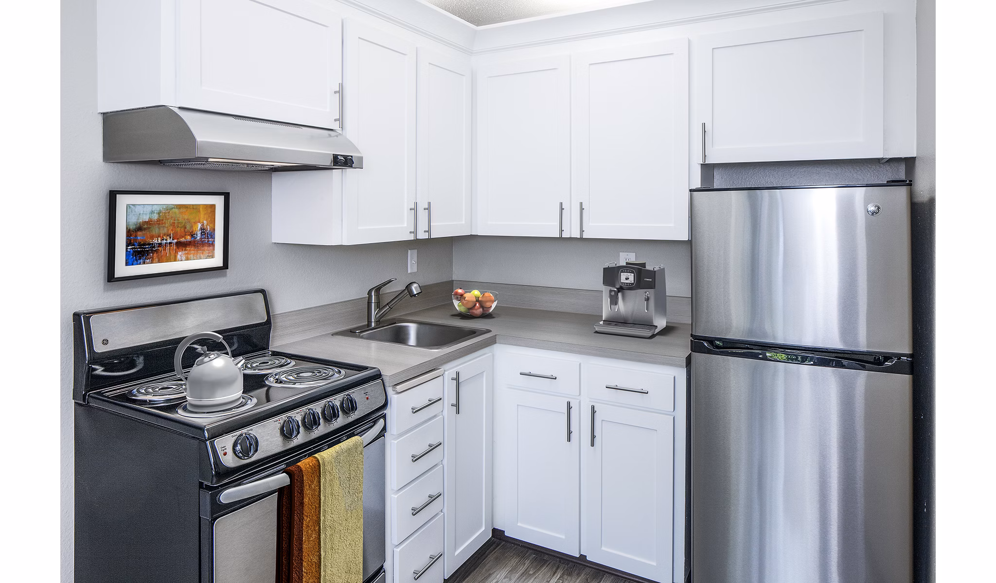 Modern kitchen with stainless steel appliances at Parkridge Apartments