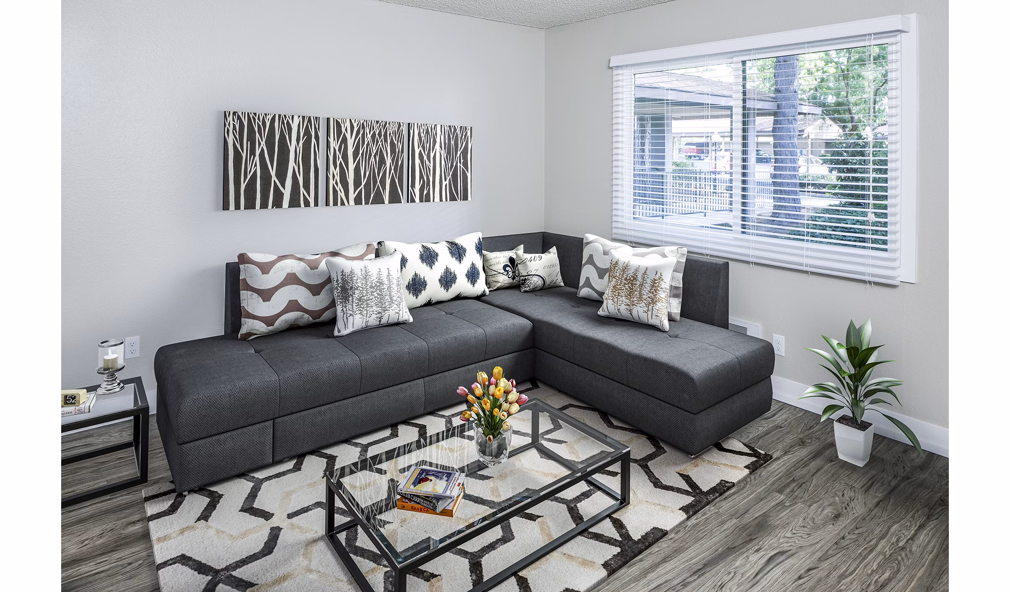 â€œSpacious living room with chic decor and ample natural light in Parkridge Apartments, luxury rentalsâ€