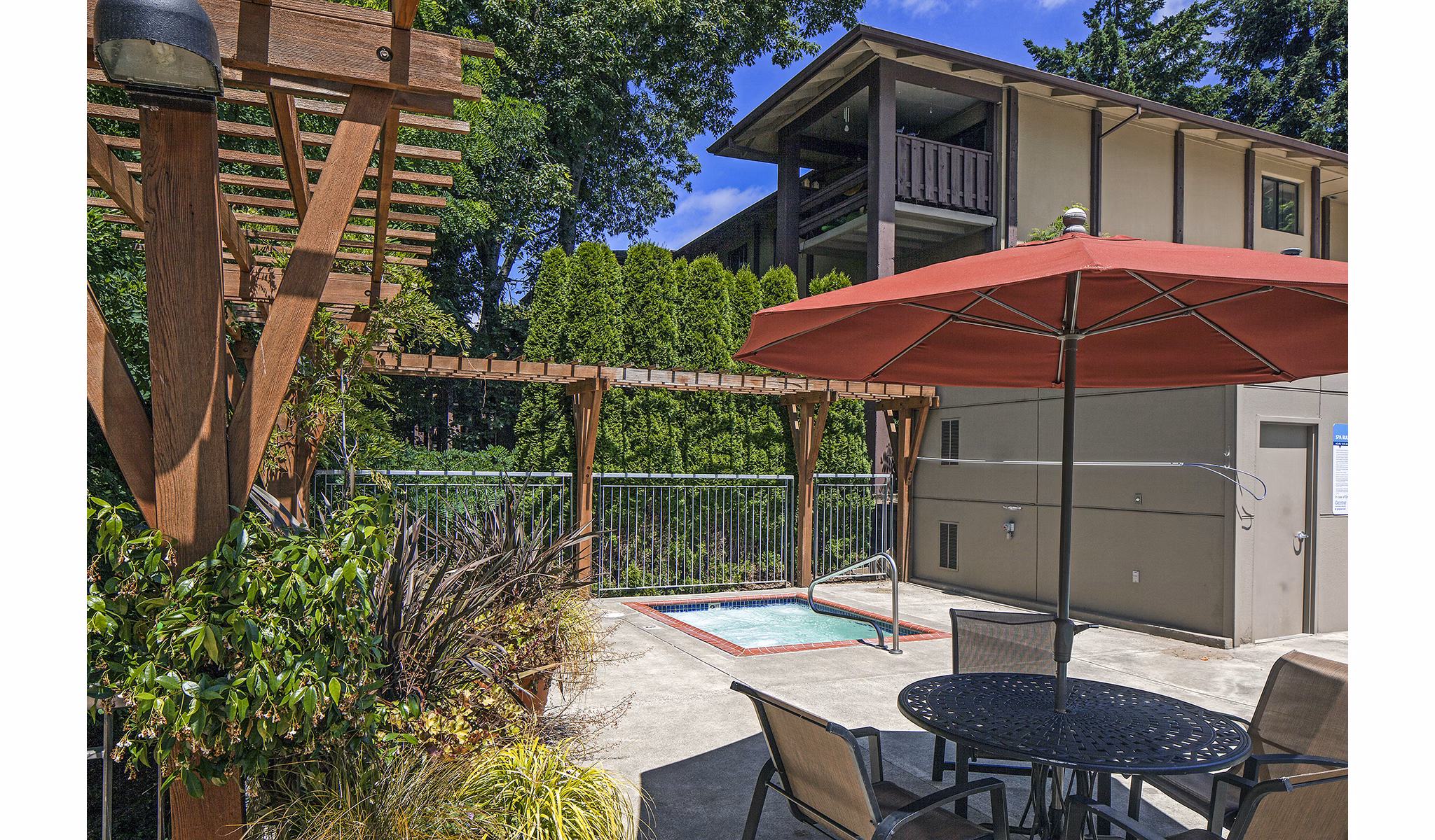 Luxurious pool with resort-style seating at Parkridge Apartments
