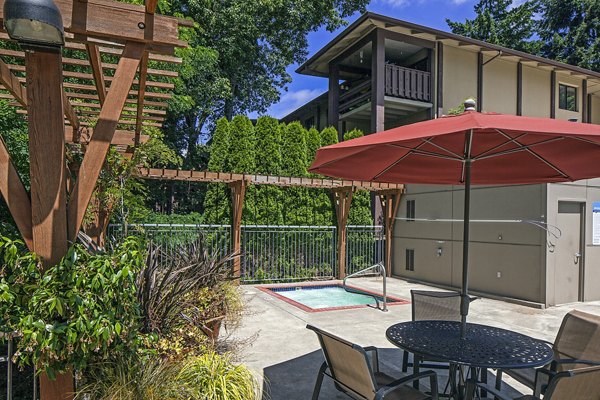 Luxurious pool with resort-style seating at Parkridge Apartments