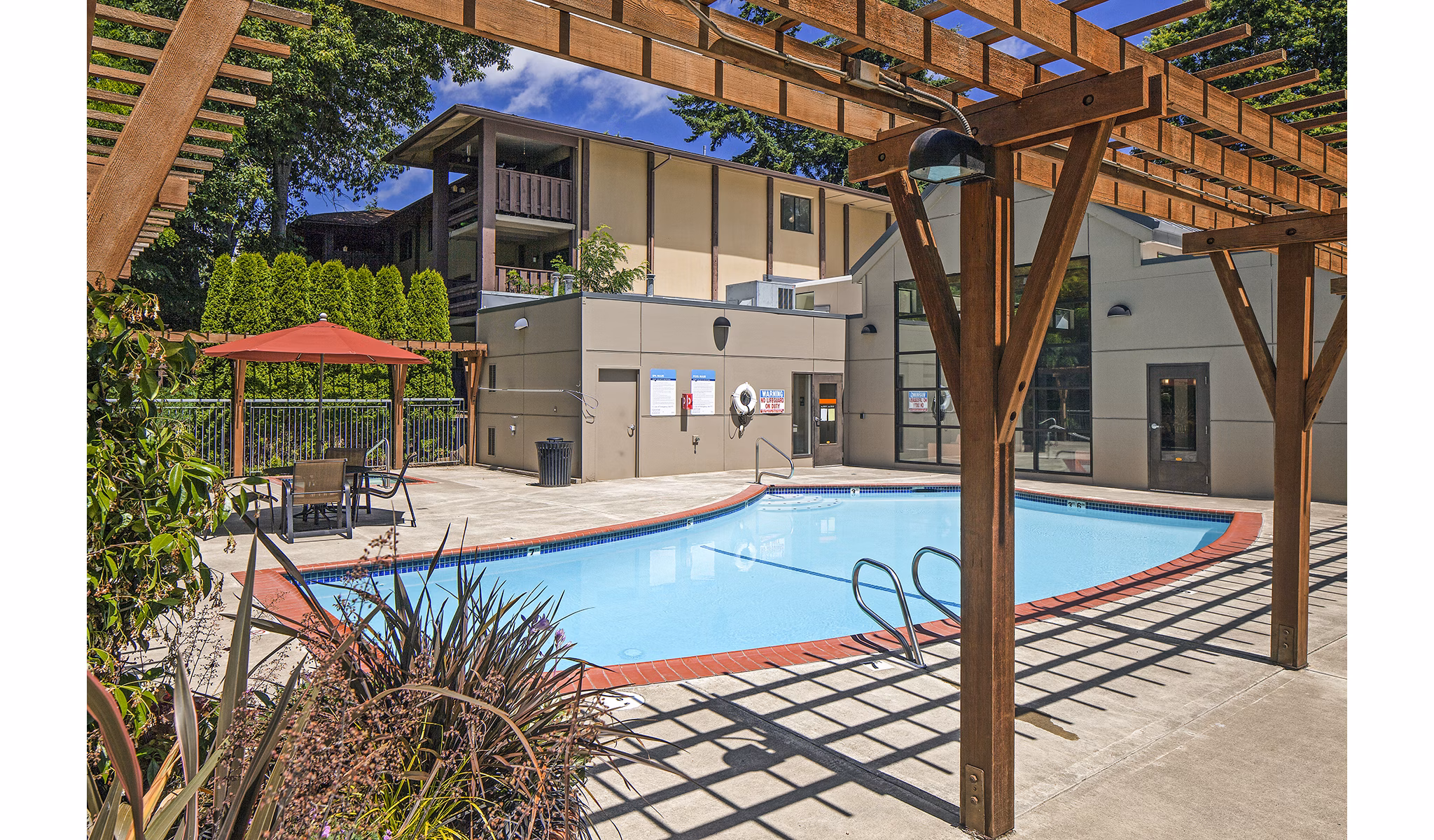 Serene poolside area at Parkridge Apartments, a Greystar luxury community offering relaxation and leisure in a tranquil setting