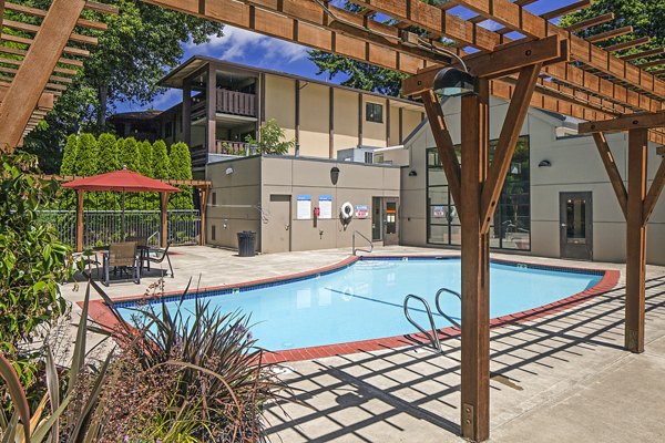 Serene poolside area at Parkridge Apartments, a Greystar luxury community offering relaxation and leisure in a tranquil setting