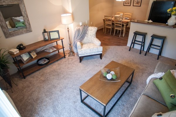 Spacious living room with modern decor in The Homestead Apartments