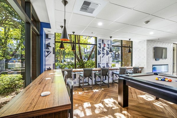 Game room featuring billiards and modern decor at The Bristol at Southport Apartments