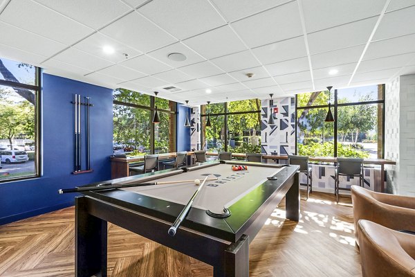 The Bristol at Southport: Modern clubhouse game room with pool table and lounge seating
