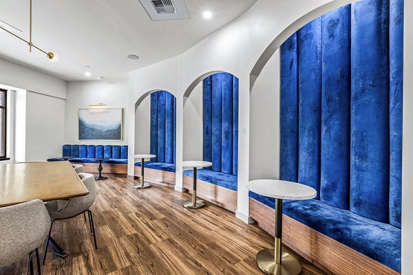 Clubhouse lounge with modern decor and seating at The Bristol at Southport Apartments