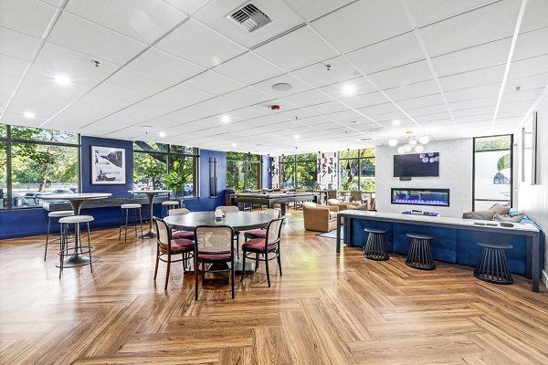 Clubhouse with modern amenities at The Bristol at Southport Apartments, ideal for gatherings and relaxation