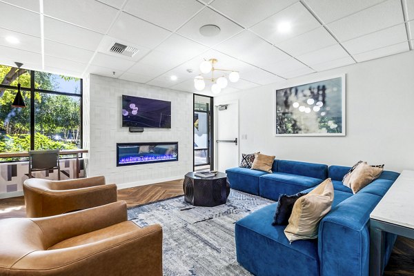 Modern clubhouse with stylish seating and HDTVs at The Bristol at Southport Apartments