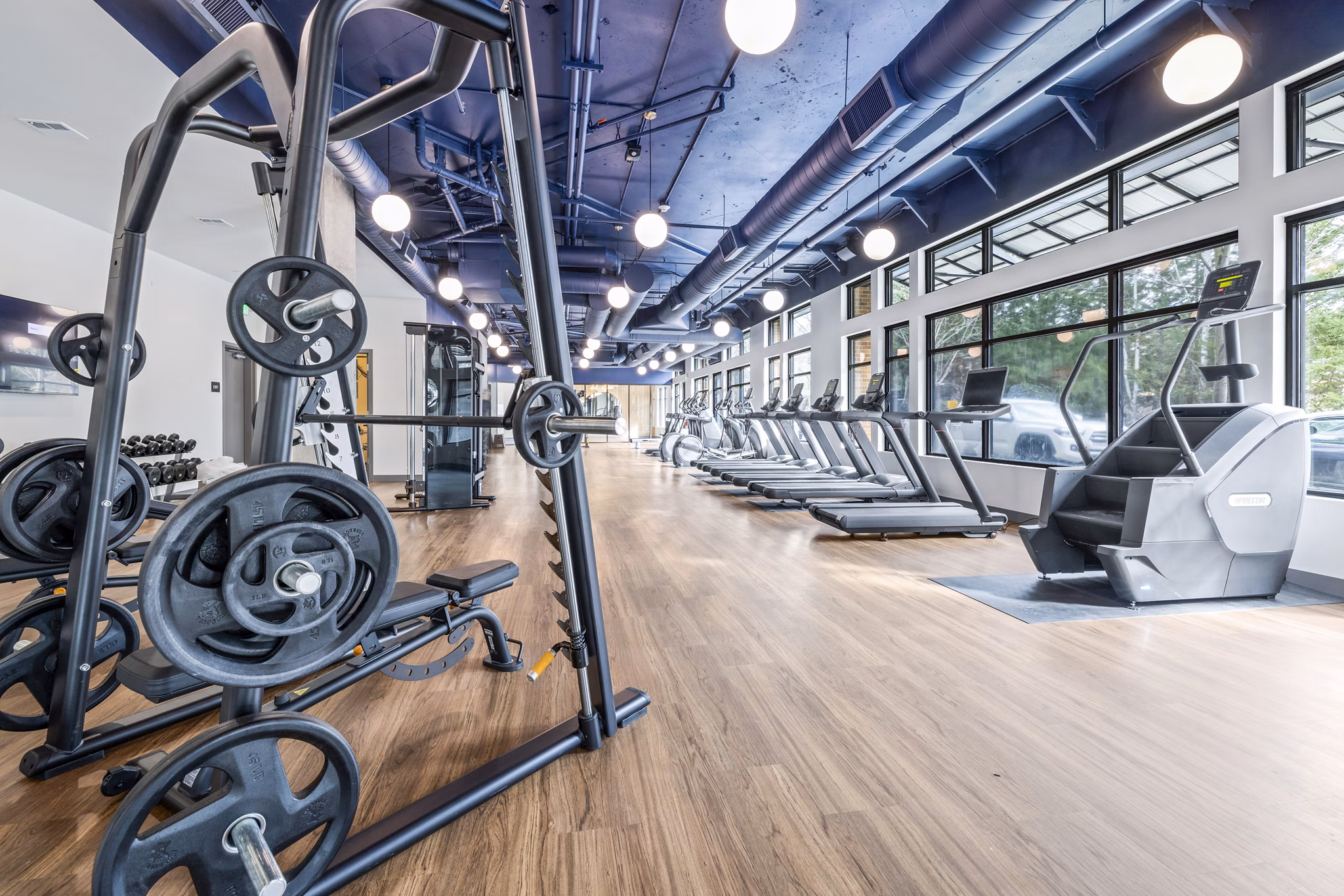 Modern fitness center with state-of-the-art equipment at The Bristol at Southport Apartments for active lifestyles