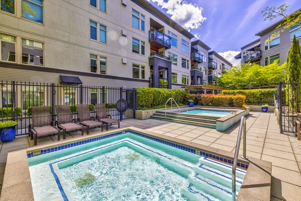 Refreshing outdoor pool at The Bristol at Southport Apartments, ideal for relaxation and leisure activities