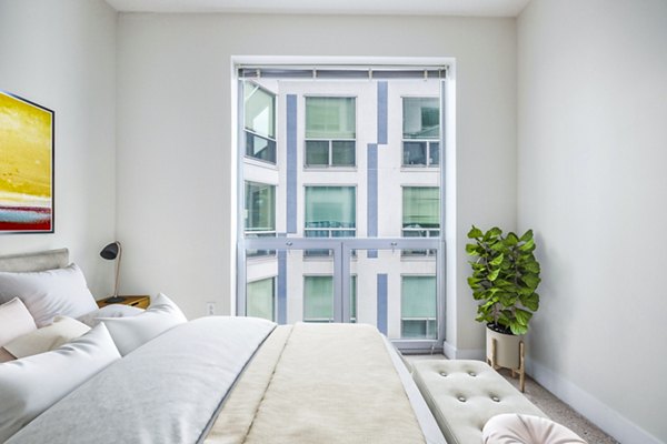 Elegant bedroom with city views at AQ Rittenhouse Apartments, luxury living in Philadelphia