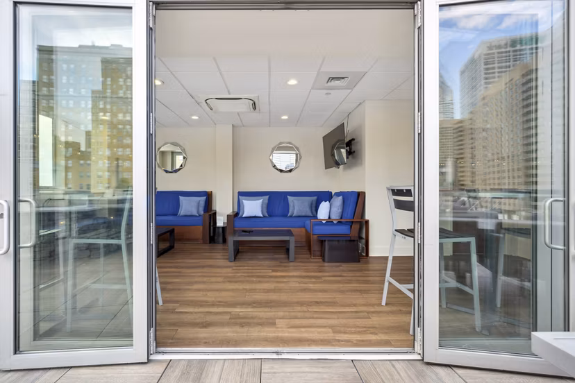 Stylish clubhouse with modern decor at AQ Rittenhouse Apartments, perfect for social gatherings in luxury Philadelphia living