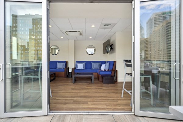 Stylish clubhouse with modern decor at AQ Rittenhouse Apartments, perfect for social gatherings in luxury Philadelphia living