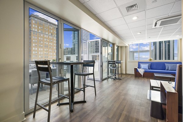 Elegant clubhouse with modern decor at AQ Rittenhouse Apartments, perfect for luxury gatherings