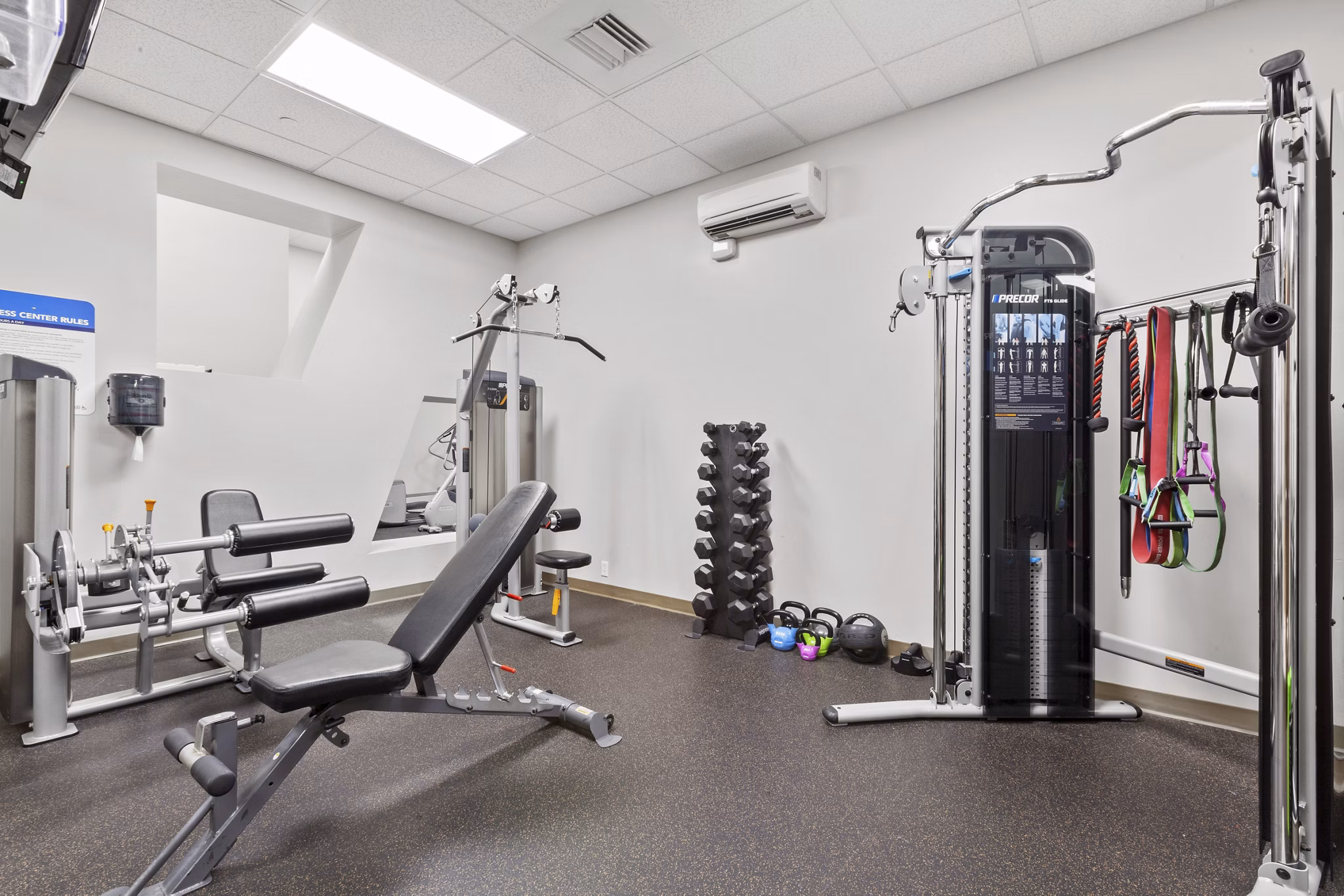 Fitness center with modern equipment at AQ Rittenhouse Apartments