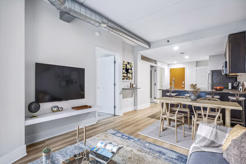 Spacious living room with modern decor in AQ Rittenhouse Apartments, luxury Greystar-managed property in a desirable Philadelphia neighborhood