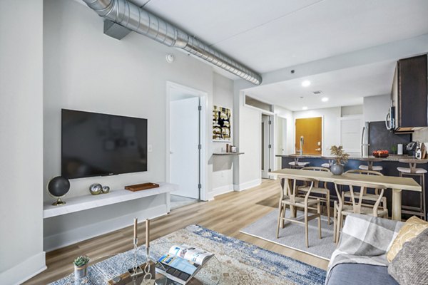 Spacious living room with modern decor in AQ Rittenhouse Apartments, luxury Greystar-managed property in a desirable Philadelphia neighborhood