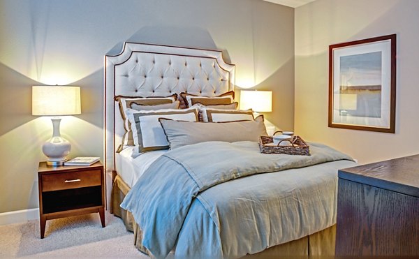 Cozy bedroom with modern decor at Retreat at the Woodlands Apartments