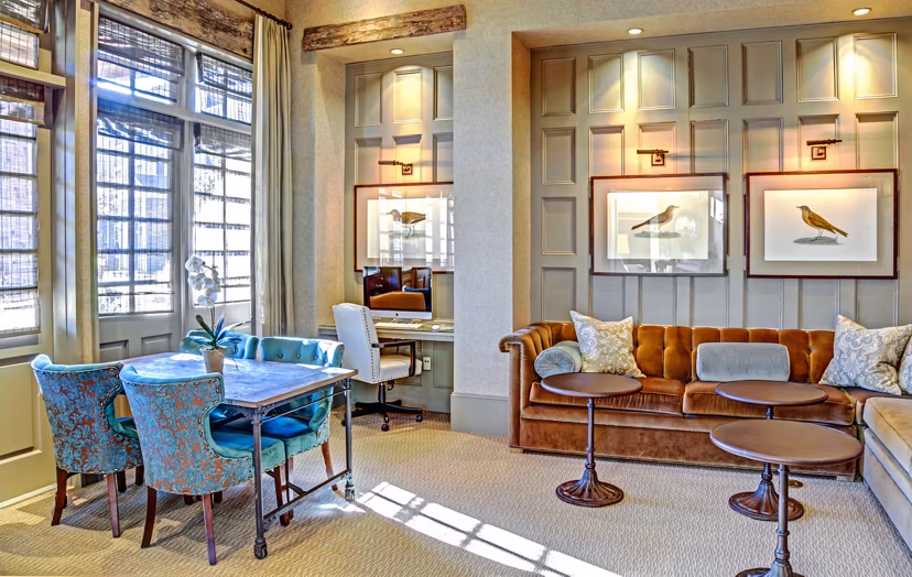Elegant clubhouse at Retreat at the Woodlands Apartments featuring cozy seating areas and modern decor