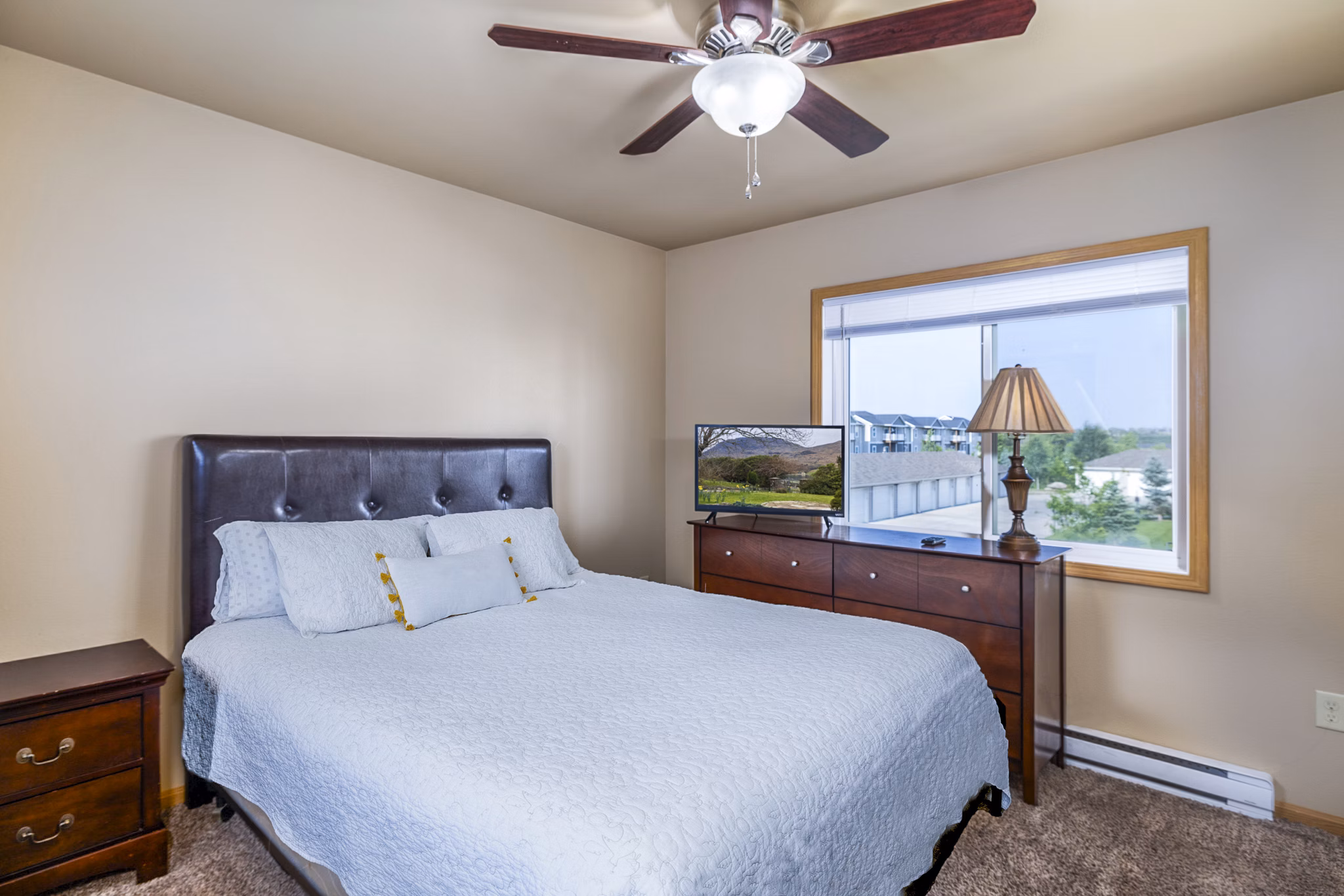 Stylish bedroom with elegant decor at Plantation at Hunters Run Apartments