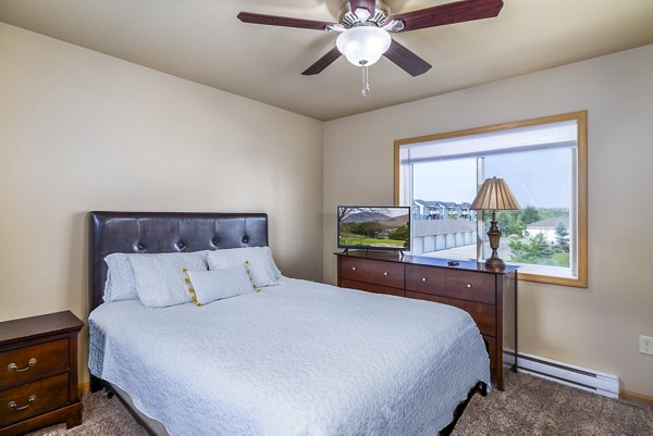 Stylish bedroom with elegant decor at Plantation at Hunters Run Apartments