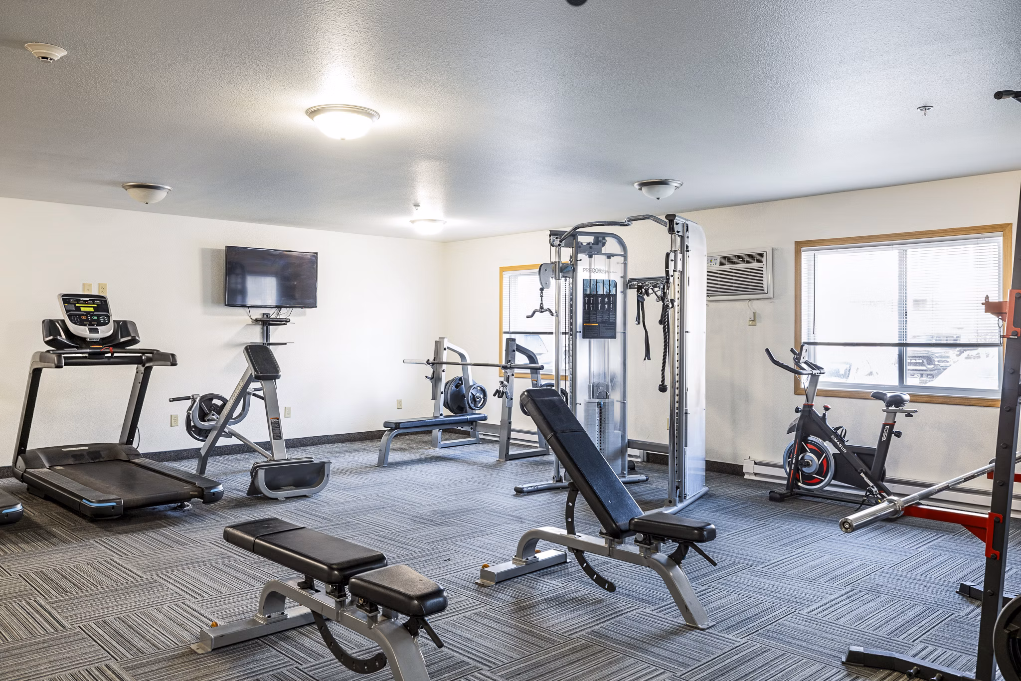 State-of-the-art fitness center at Plantation at Hunters Run Apartments offering modern workout equipment and spacious exercise areas